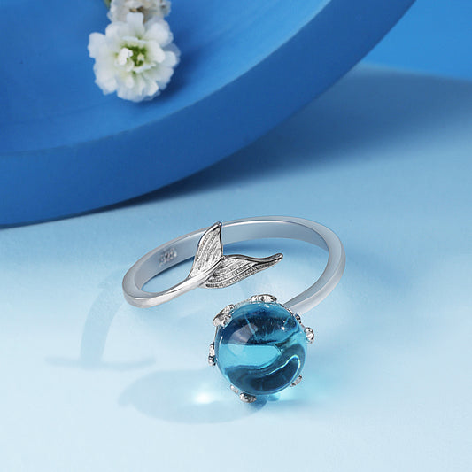 Silver ring with blue stone